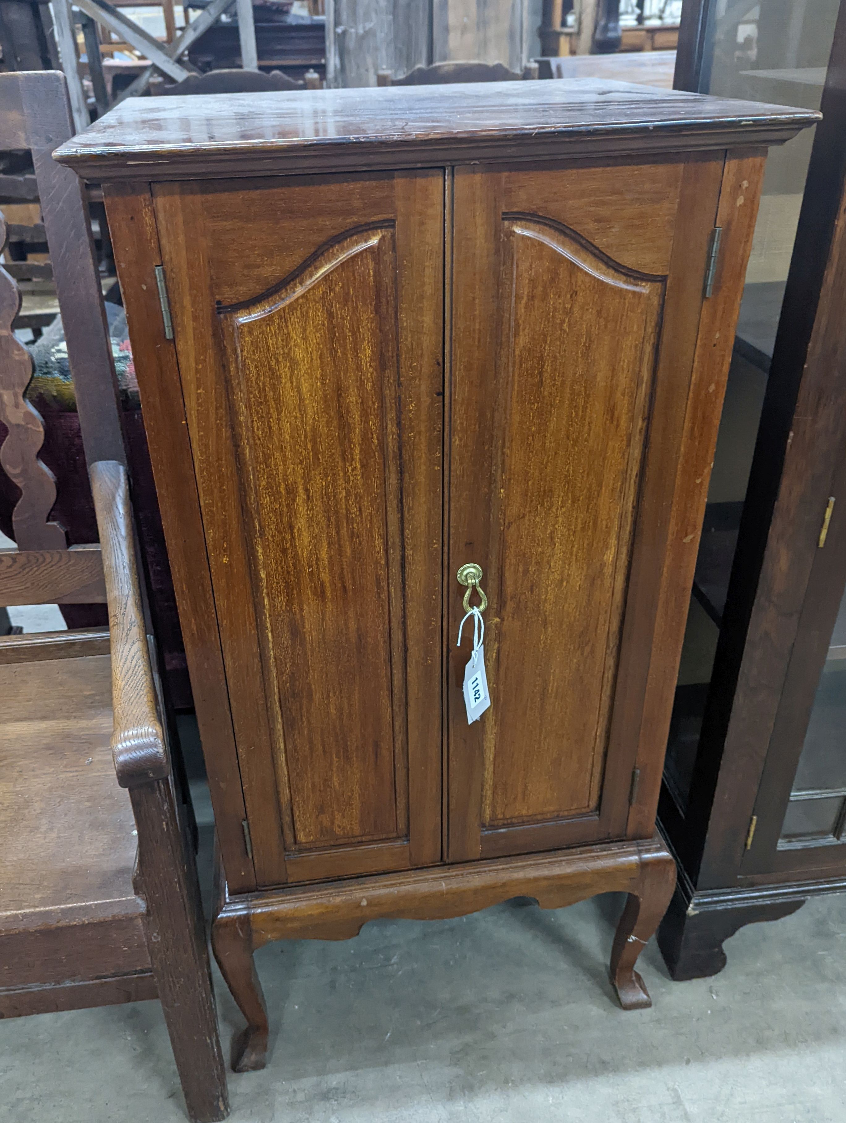 An Edwardian mahogany sheet music cabinet, width 52 cms, depth 46 cms, height 103 cms.